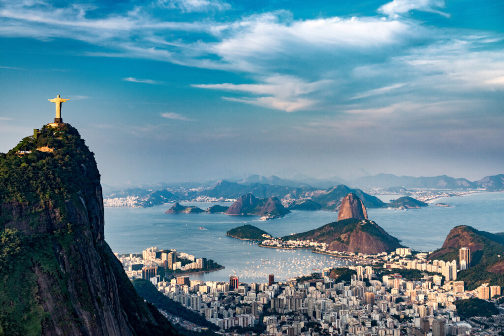 Aerial view of Rio De Janeiro. Corcovado mountain with statue of Christ the Redeemer, urban areas of Botafogo and Centro, Sugarloaf mountain.